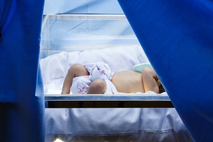 premature baby in basket at hospital