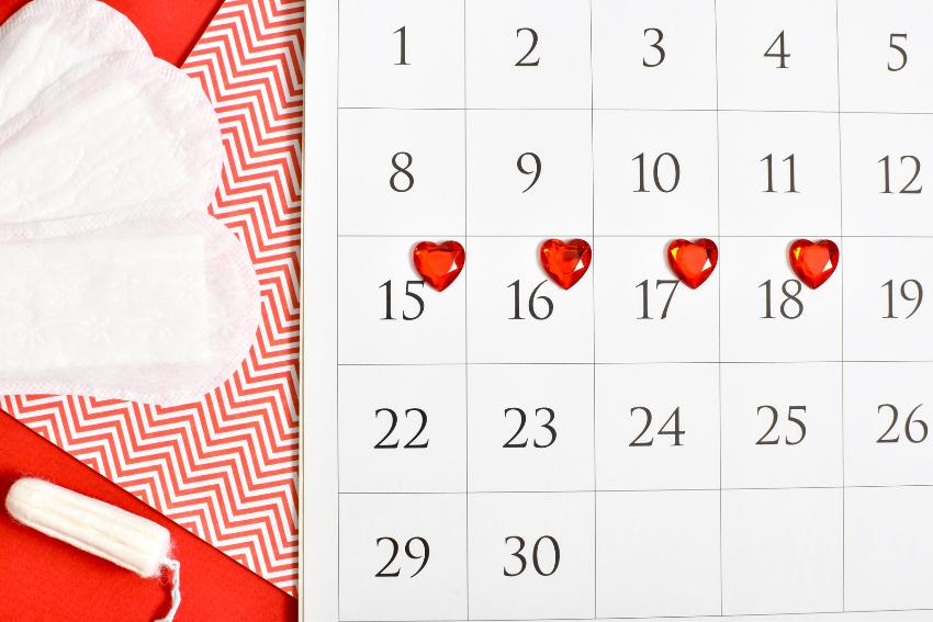 calendar with period marked with red hearts