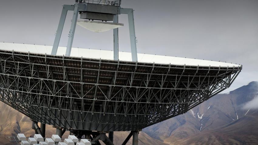 Satellite dish in an Arctic landscape