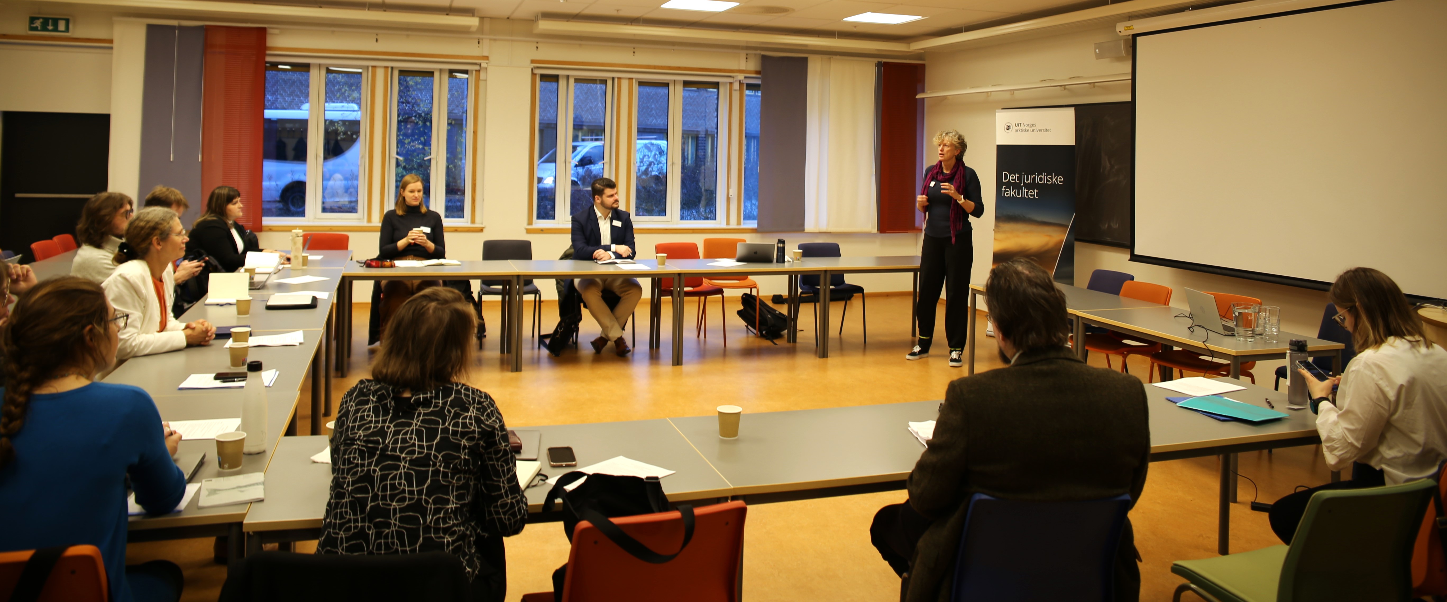 The audience listening to a panel earlier in the workshop