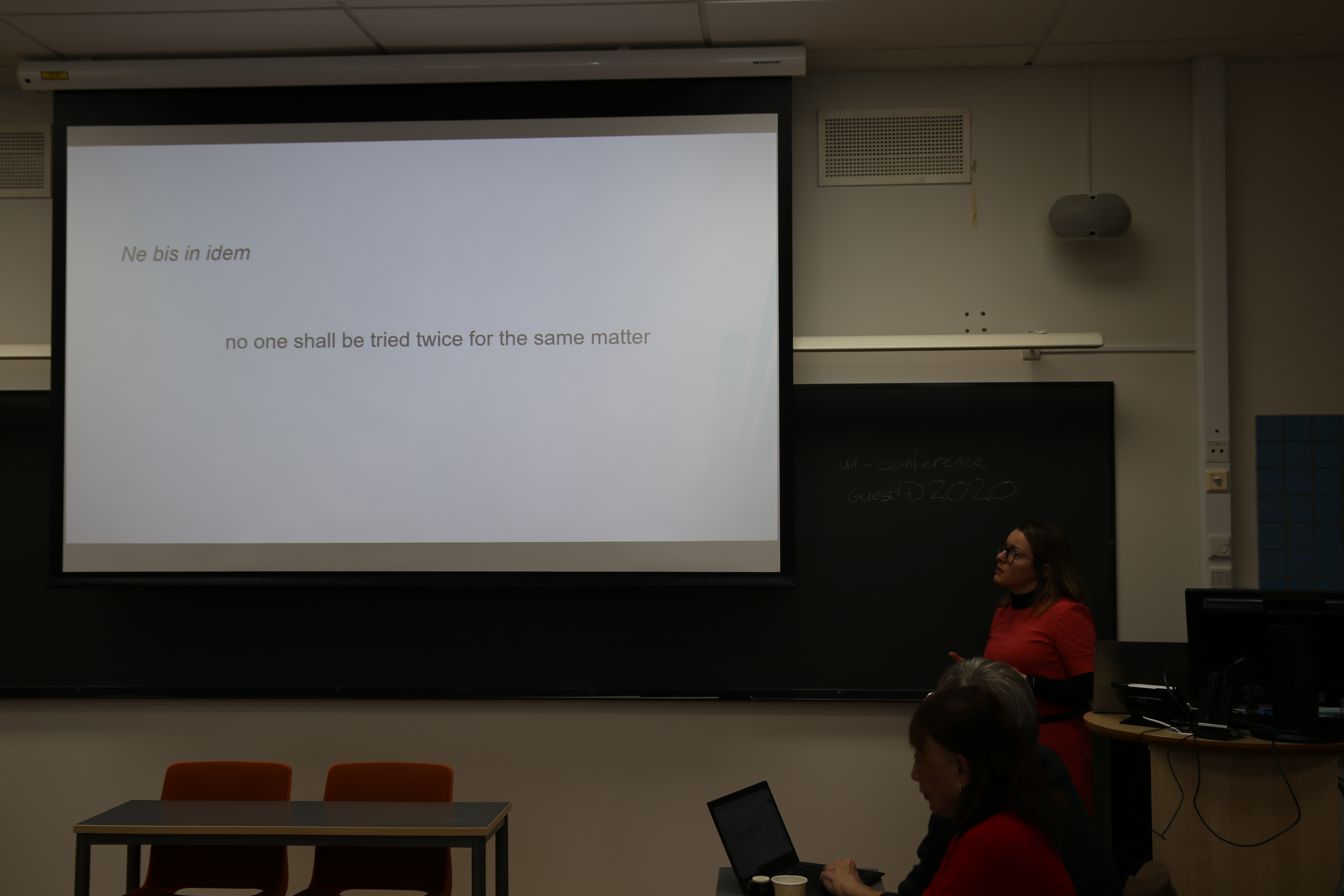 Gaiane standing by her presentation on Ne Bis in Idem