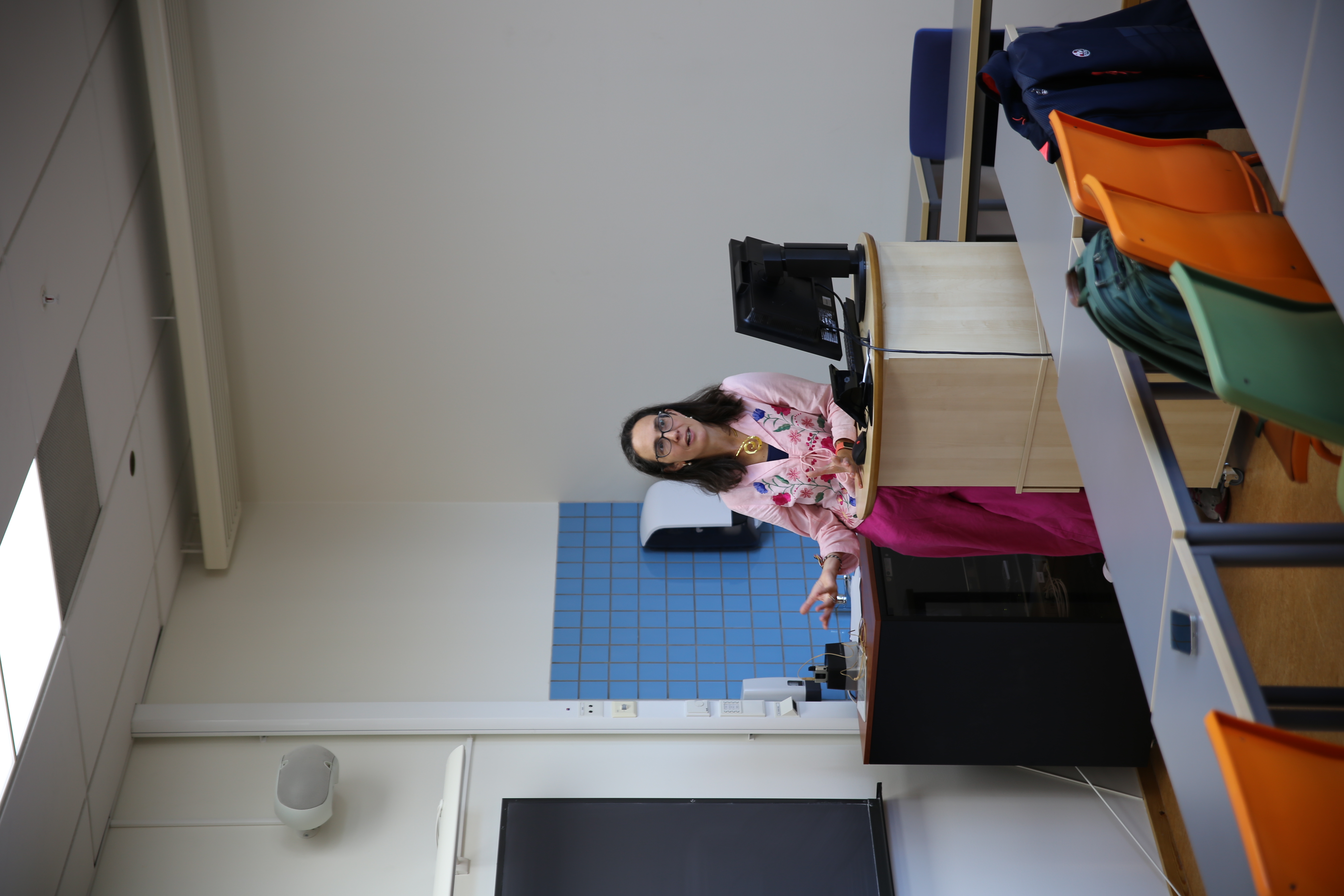 Sarah is answering questions from the audience