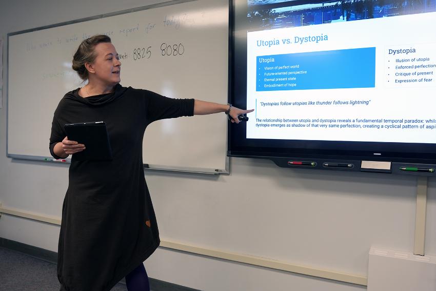 A person standing in front of a presentation talking