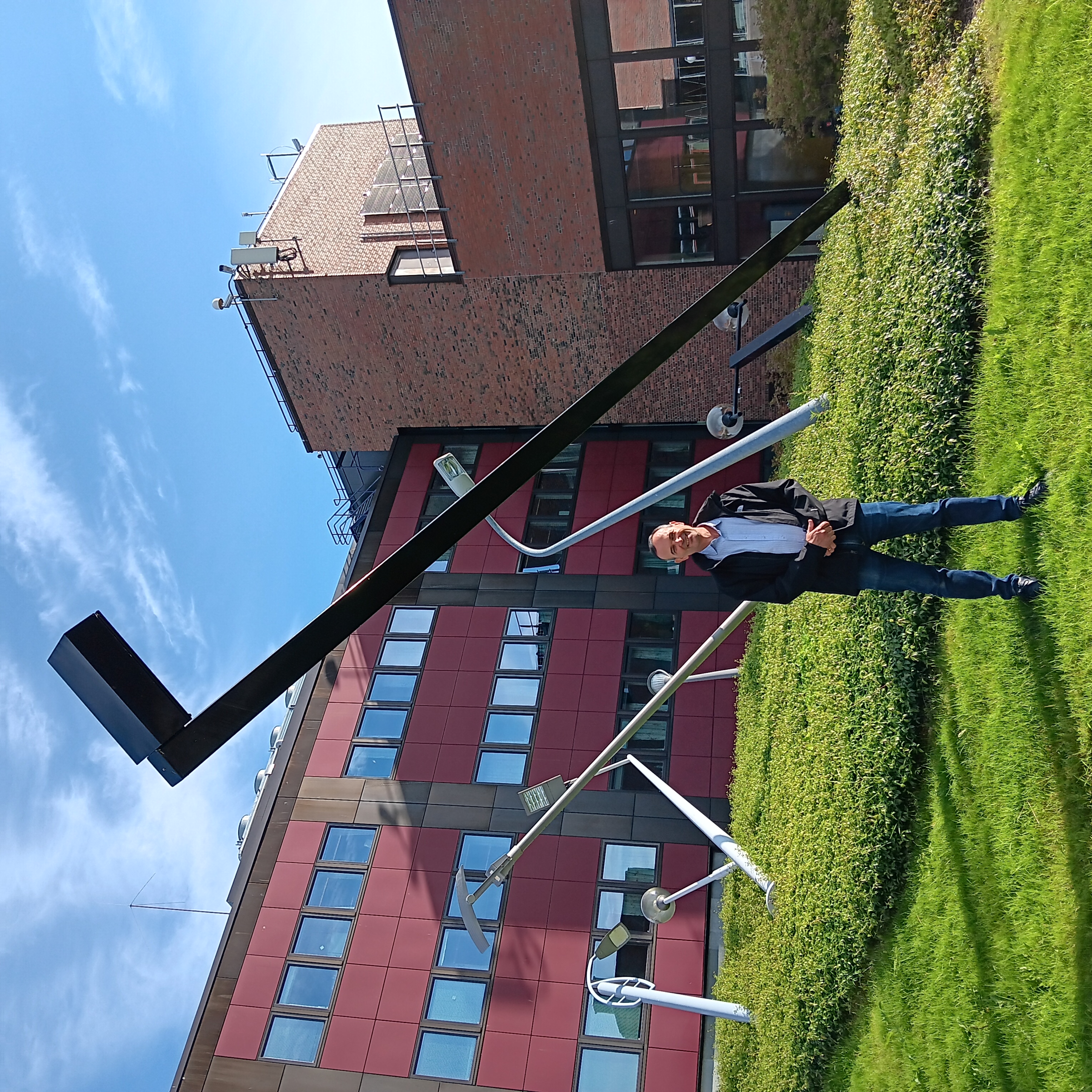 Man standing in front of an art installation.