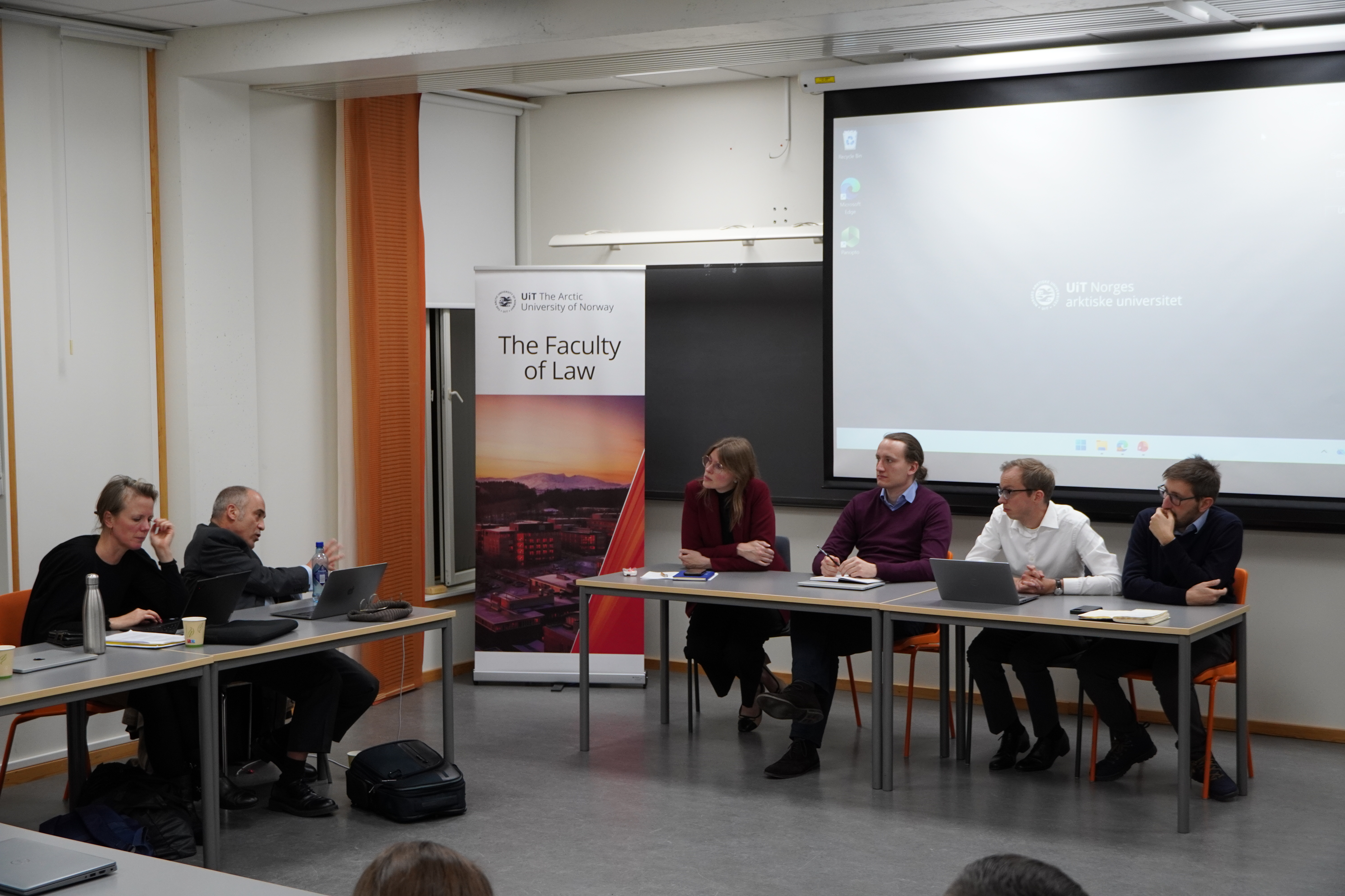 The panel is listening to a question from Roger