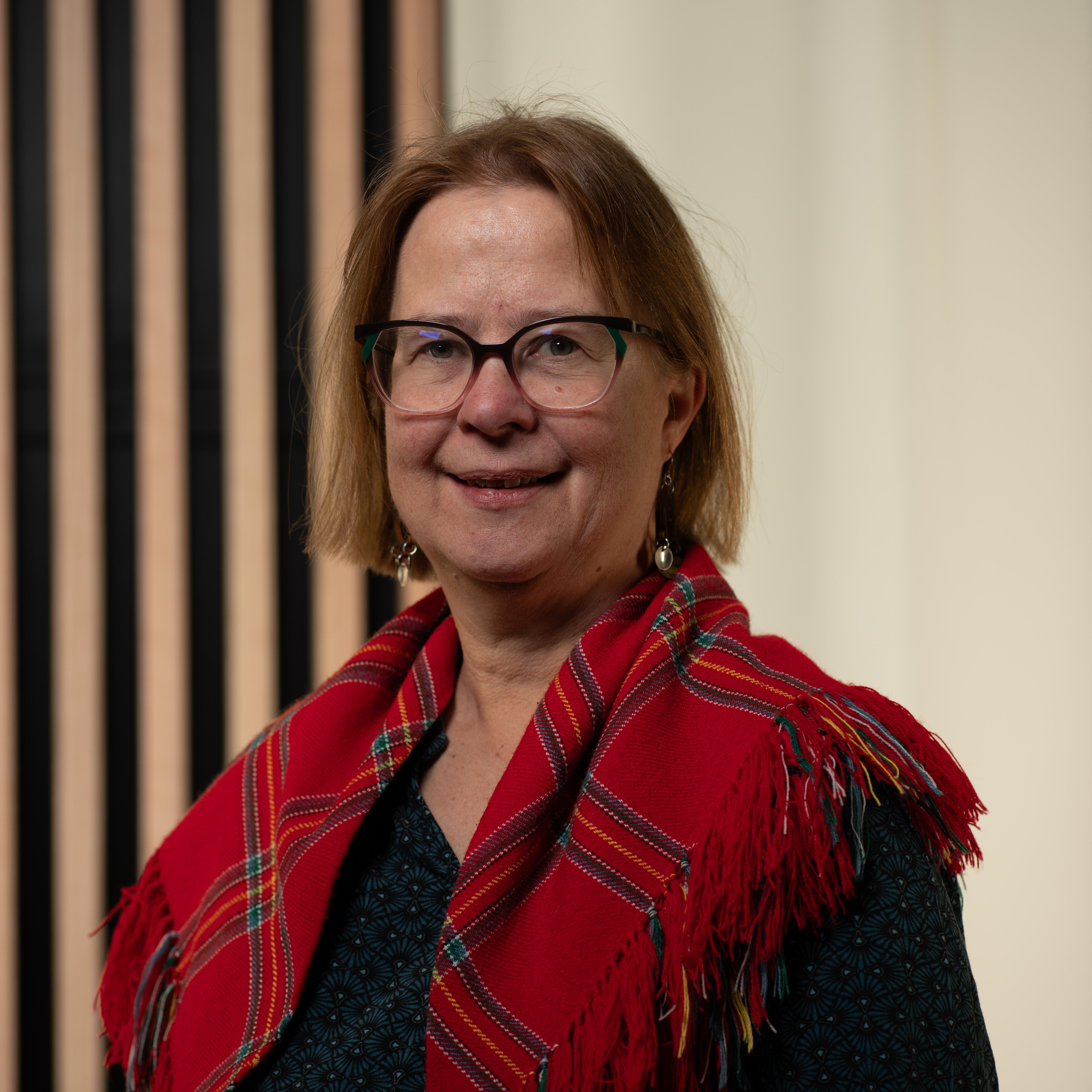 woman with red shawl
