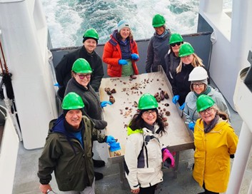 People gathered on the deck of a boat.