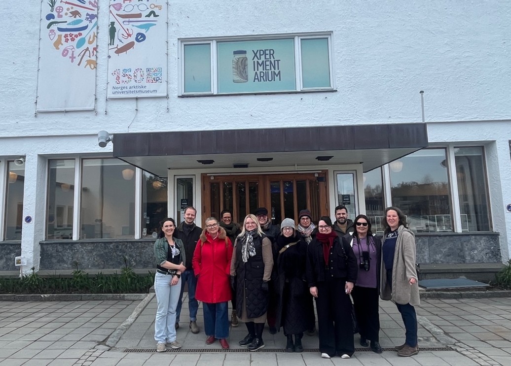 People gathered before a museum.