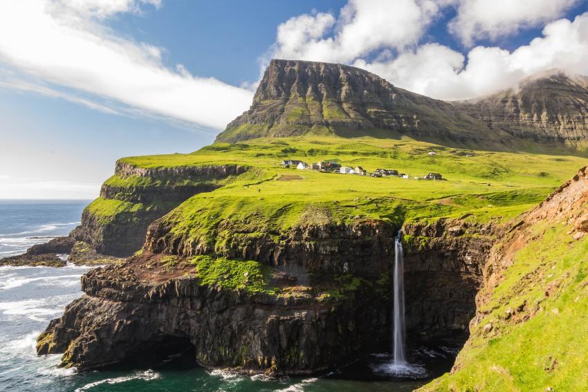 Landscape from The Faroe Islands, featuring the ocean, cliffs and waterfalls
