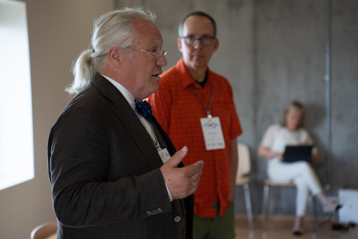 Two men at a conference