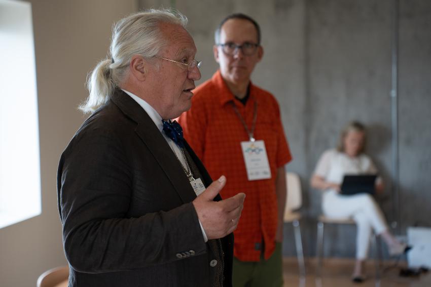 Two men at a conference